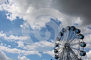 Amusement ride a large Ferris wheel in the Park against the sky