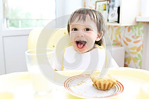 Amusing baby having dinner