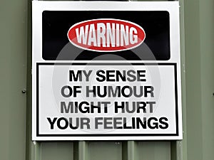 An amusing sign warning `My sense of humour might hurt your feelings` photo