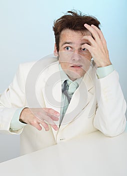 Amusing tousled scared person in white jacket photo