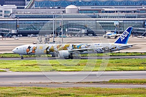 ANA All Nippon Airways Boeing 777-300ER airplane at Tokyo Haneda Airport in Japan Pokemon Eevee special livery