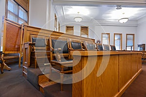 The jury box in a courtroom in the Deer Lodge County Courthouse, Anaconda, Montana, USA