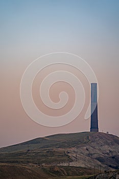 Anaconda Smelter Stack in Montana is the tallest survivng masonry building in the world, taken on a hazy night at sunset