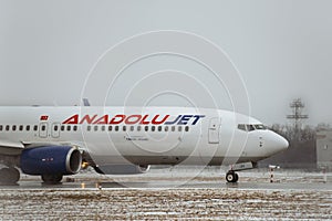 Anadoly airlines aircraft taxiing after landing in Boryspil international airport.  Close up shot of Modern passenger airplane on