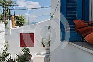 Anafiotika neighborhood in Athens near Acropolis hill. Travel destination. White houses and blue windows