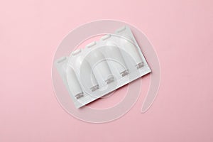 Anal or vaginal candles on pink background