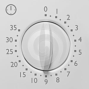 Analog 35 minute microwave oven timer, analogue vintage white dial face macro closeup grey numbers and icon, large