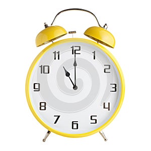 Analog alarm clock showing eleven o`clock, 11pm or 11am isolated on white background photo