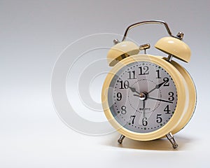 Analog alarm clock on white background