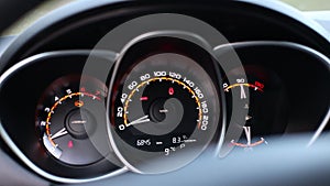 analog car dashboard. Tachometer with speedometer and trip computer in black and red