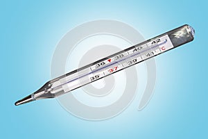 Analog clinical thermometer, mercury free, calibrated in degrees centigrade indicating a temperature of 38.5 degrees centigrade.