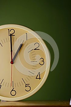 An analog clock at one o'clock position