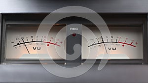 Analog recording level indicators on a reel-to-reel tape recorder in 4k. Signal indicator with arrow