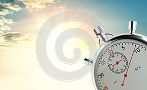 Analog stopwatch against the background of sunrise