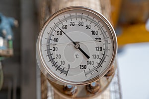 Analog temperature gauge for reading discharge temp of compressor at offshore oil and gas wellhead remote platform photo