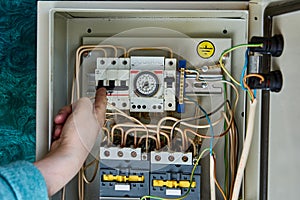 Analog time switch for controlling boiler and heating on real-time located inside electrical board.