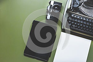 Analog Typewriter, Digital Tablet And Film Camera On The Green Table, Top View