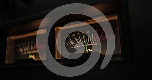 Analog VU meters on classic hi-fi reel-to-reel tape recorder. Retro sound level meter decibel meter in studio, vintage photo