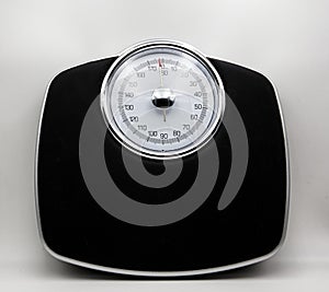 Analogic scale isolated on white. Weight control concept photo