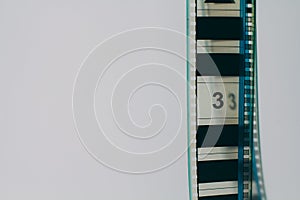 Analogue film strip in right corner with copyspace on white background