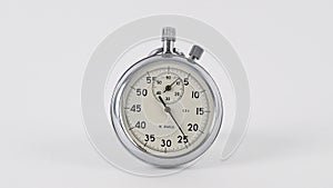 Analogue metal stopwatch on the white background