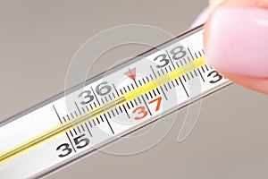 Analogue thermometer isolated on light grey background, close up