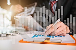 Analysis investment researching with chart at office desk documents in office.