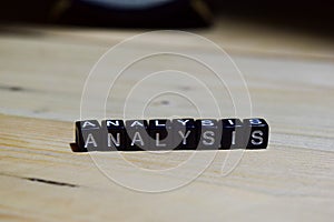 Analysis written on wooden blocks. Education and business concep