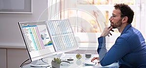 Analyst Employee Using Spreadsheet