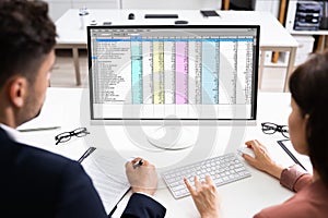 Analyst Employee Working On Spreadsheet