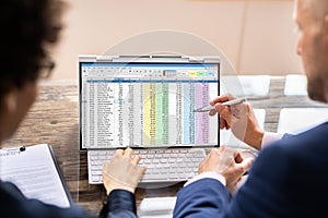 Analyst Employee Working On Spreadsheet