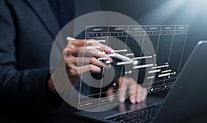 Analyst using computer working in Business Analytics and Data Management System to make report with KPI and metrics connected to