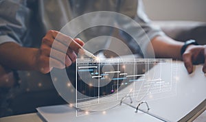 Analyst working with Business Analytics and Data Management System on computer, make a report with KPI and metrics