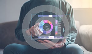 Analyst working with Business Analytics and Data Management System on computer, make a report with KPI and metrics