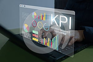 Analyst working with Business Analytics and Data Management System on computer to make report with KPI and metrics connected to