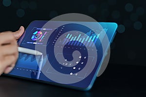Analyst working in Business Analytics and Data Management System to make report with KPI and metrics connected to database.