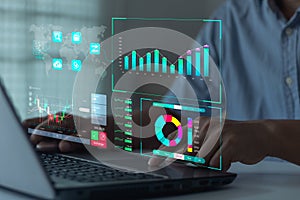 Analyst working with Business Analytics Technology and Data Management System on computer to make report