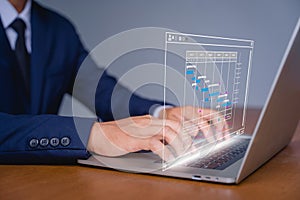 Analyst working with computer in business analytics and data management system to make report with KPI and metrics connected to