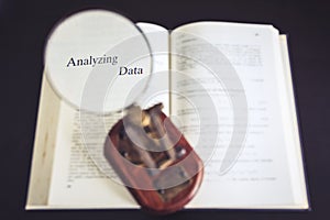 Analyze data Magnifying glass on Book Reading Research photo