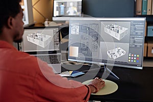 Analyzing Architectural Designs on Computer Monitors photo