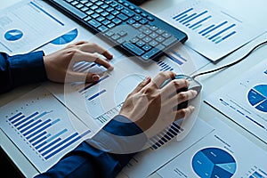 Data analysis and reporting with charts and graphs using computer keyboard and mouse for business strategy