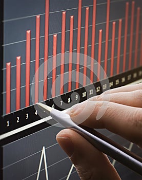 Analyzing chart on monitor