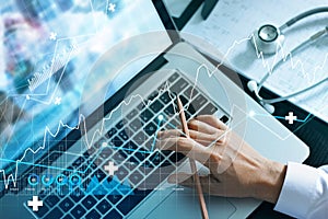 Analyzing data and growth chart healthcare business graph  and medical examination on laptop screen