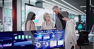 Analyzing Data On Multiple Screens: Diverse Business Meeting