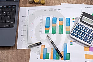 analyzing investment charts with laptop