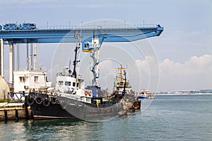 Anapa, Russia, 30.07.2019 A small ship moored to the pier of the seaport