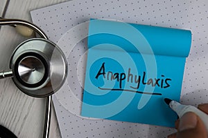 Anaphylaxis text on sticky notes with office desk. Healthcare/Medical concept