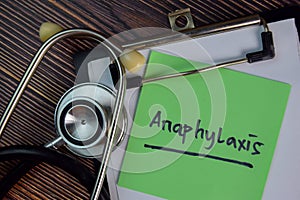 Anaphylaxis write on sticky notes isolated on Wooden Table