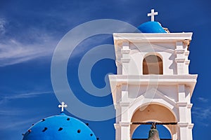Anastasis Church with its Blue Dome and Tower in Santorini, Greece photo