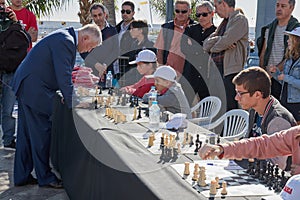 Anatoly Karpov in Marbella playing chess with kids
